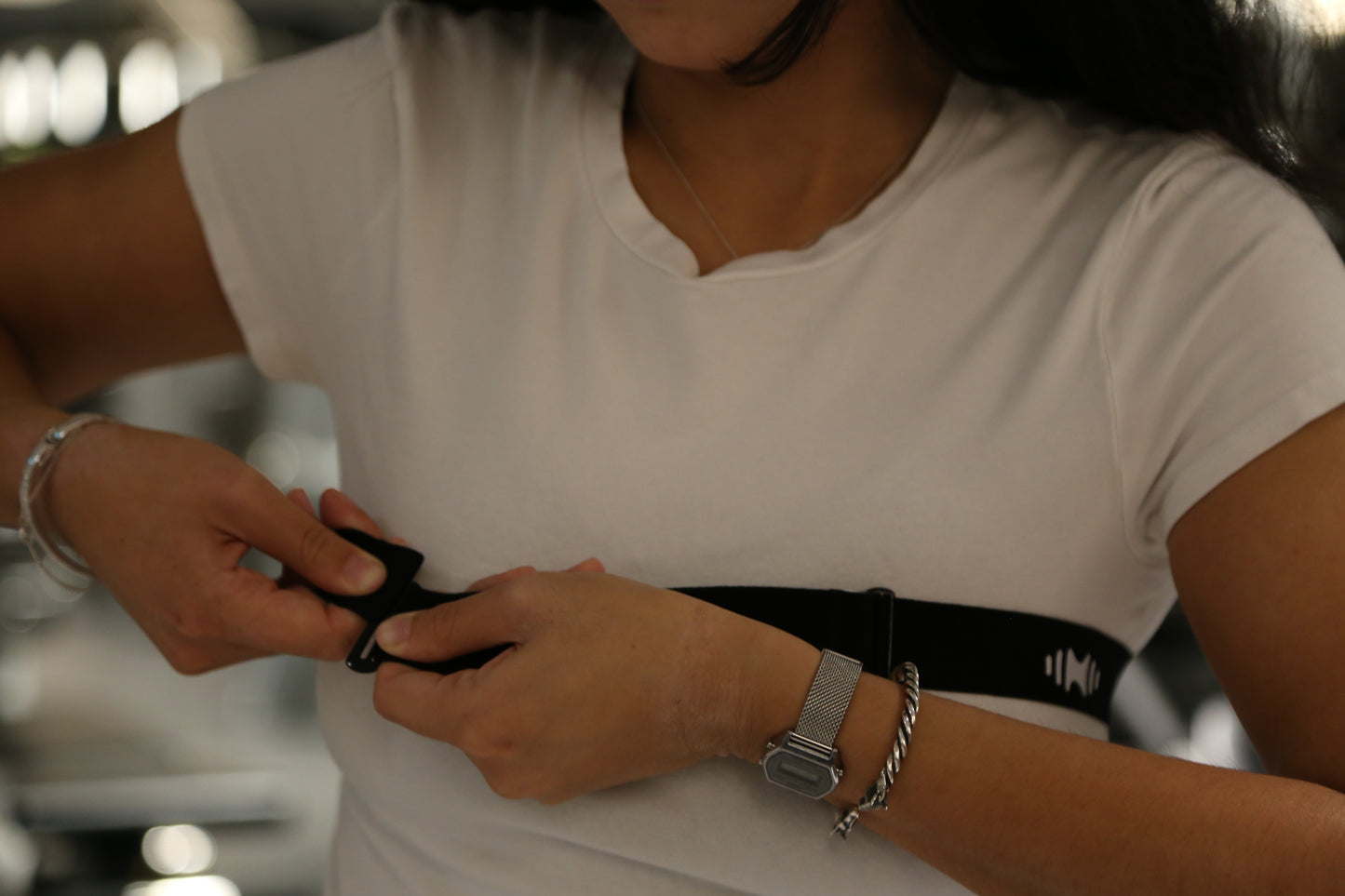 Person attaching NeumaBand for use